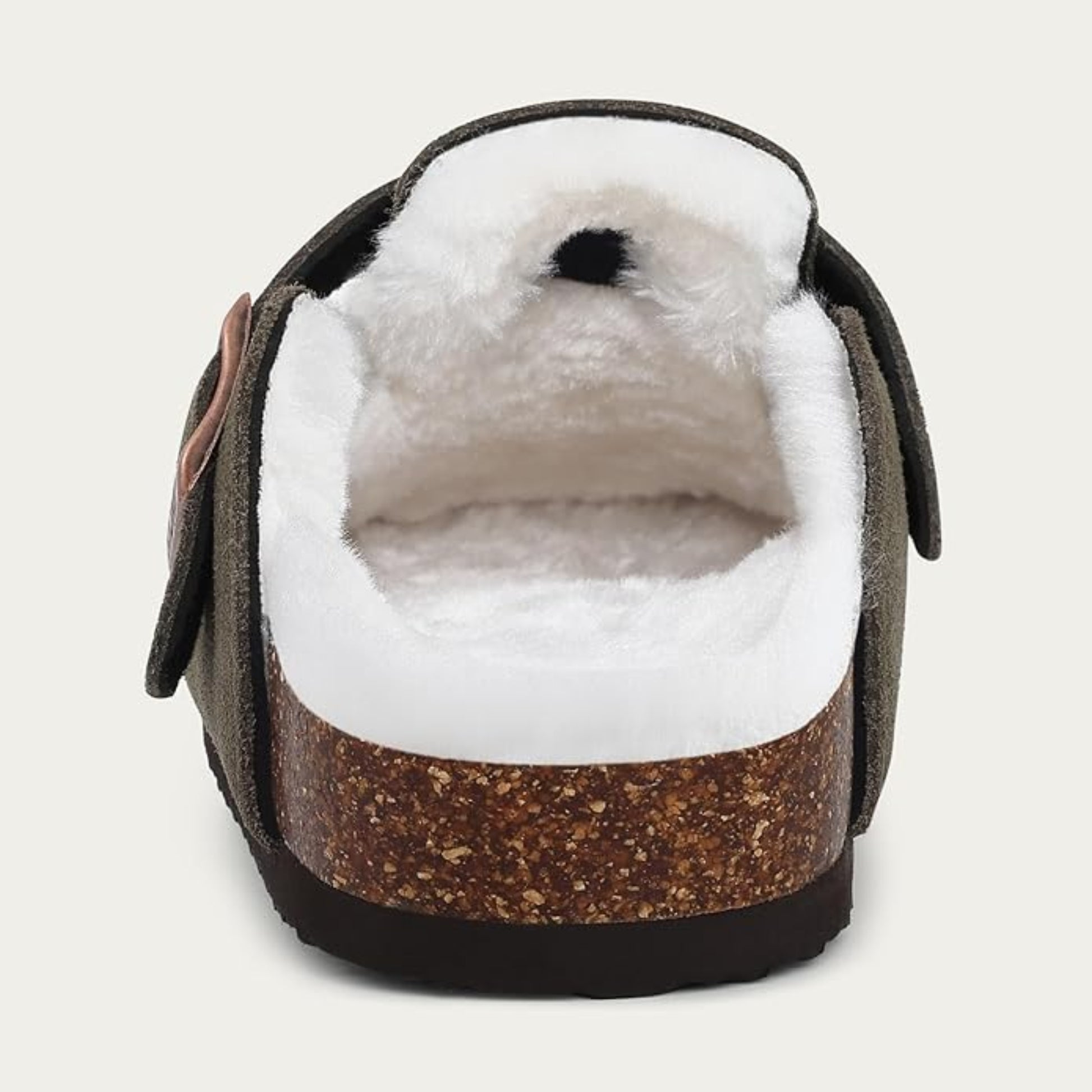 Brown and white slipper with cork-like sole on a light gray background