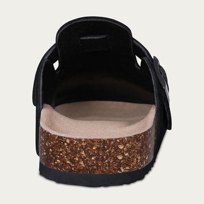 Black sandal with cork sole on a light gray background